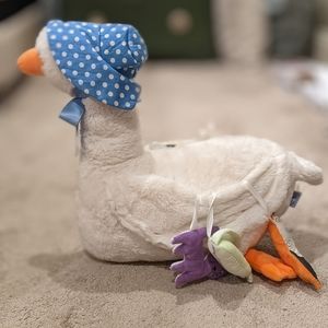 Plush mother goose with attached animals